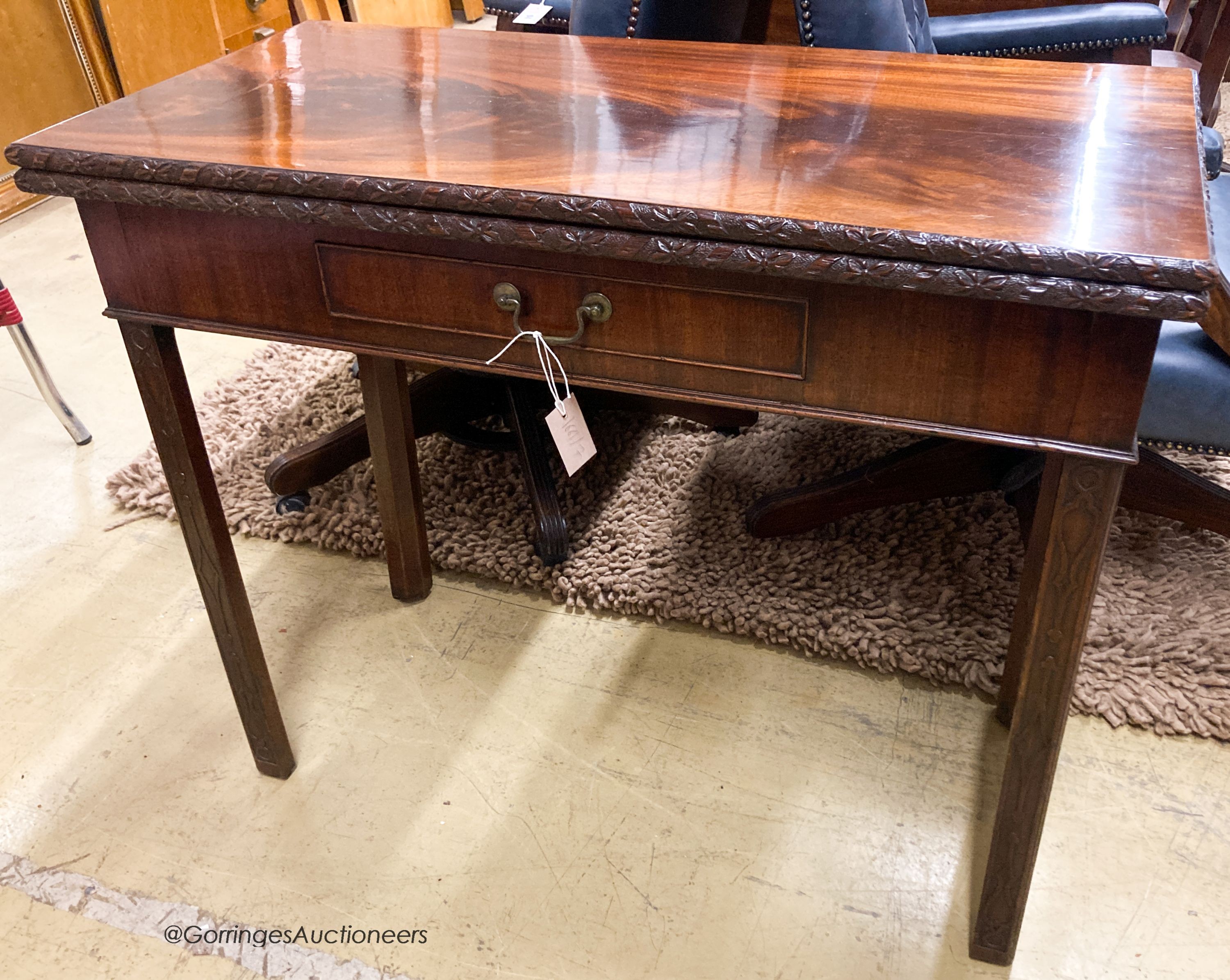 A George III rectangular mahogany concertina card table, W.93cm D.46cm H.76cm